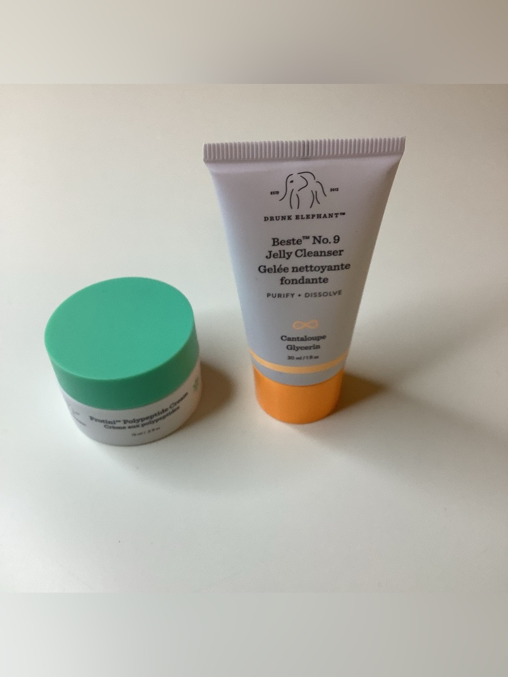 Drunk Elephant Jelly Cleanser Tube in White with Orange Cap